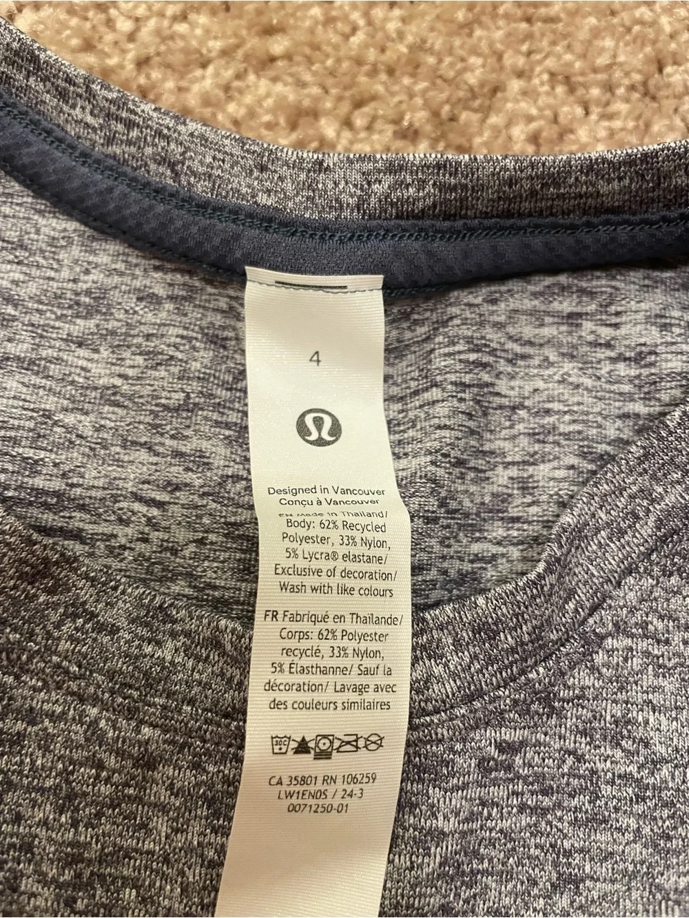 Lululemon License to Train Tight-Fit tank in heathered true navy color